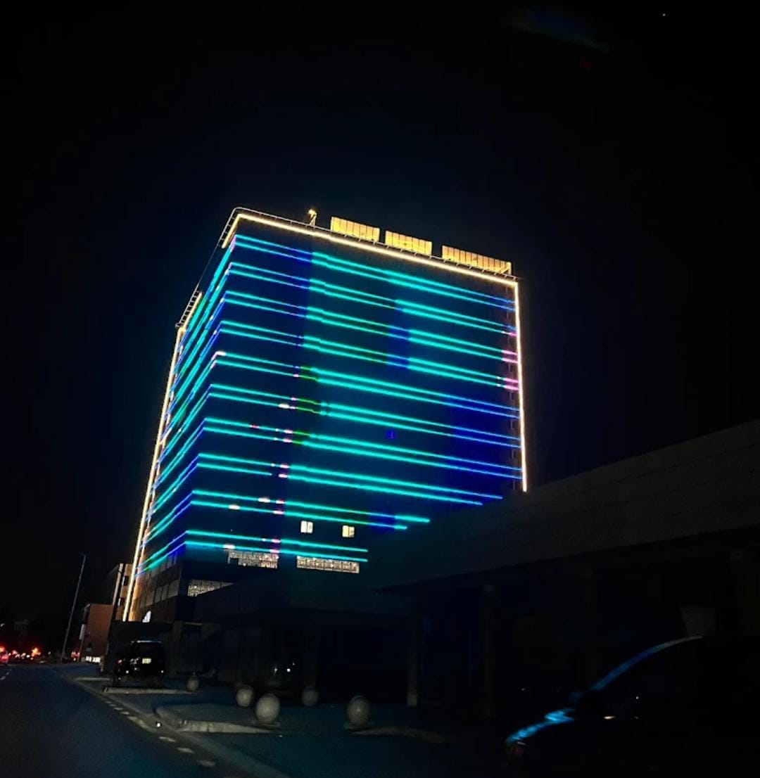 Illuminated night facade of our Jeddah headquarters — customs clearance services and global logistics solutions
